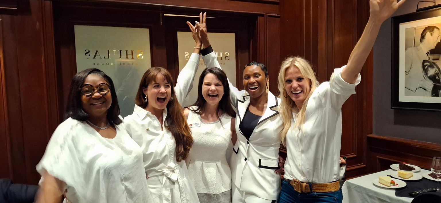Felisha D. McCaskill and women from Speakpreneur celebrating together